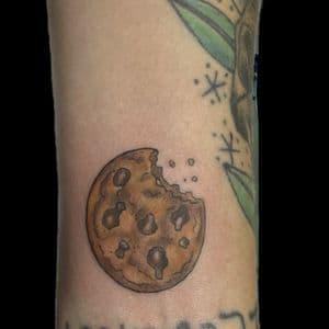 Illustrative + Color cookie tattoo on Wrist by Carmela_Bella on TattMe