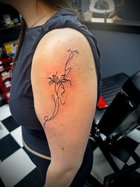 Fine Line + Minimalist flower tattoo on Upper Arm by Jr on TattMe