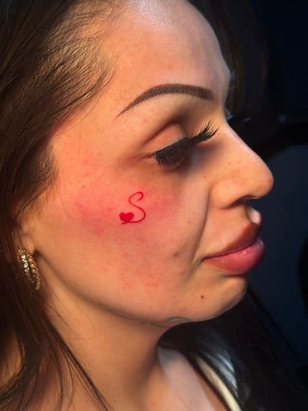 Fine Line + Minimalist letter s tattoo on Face by Jr on TattMe