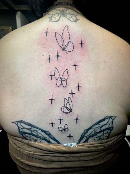 Fine Line + Black-work butterflies tattoo on Upper Back by Jr on TattMe