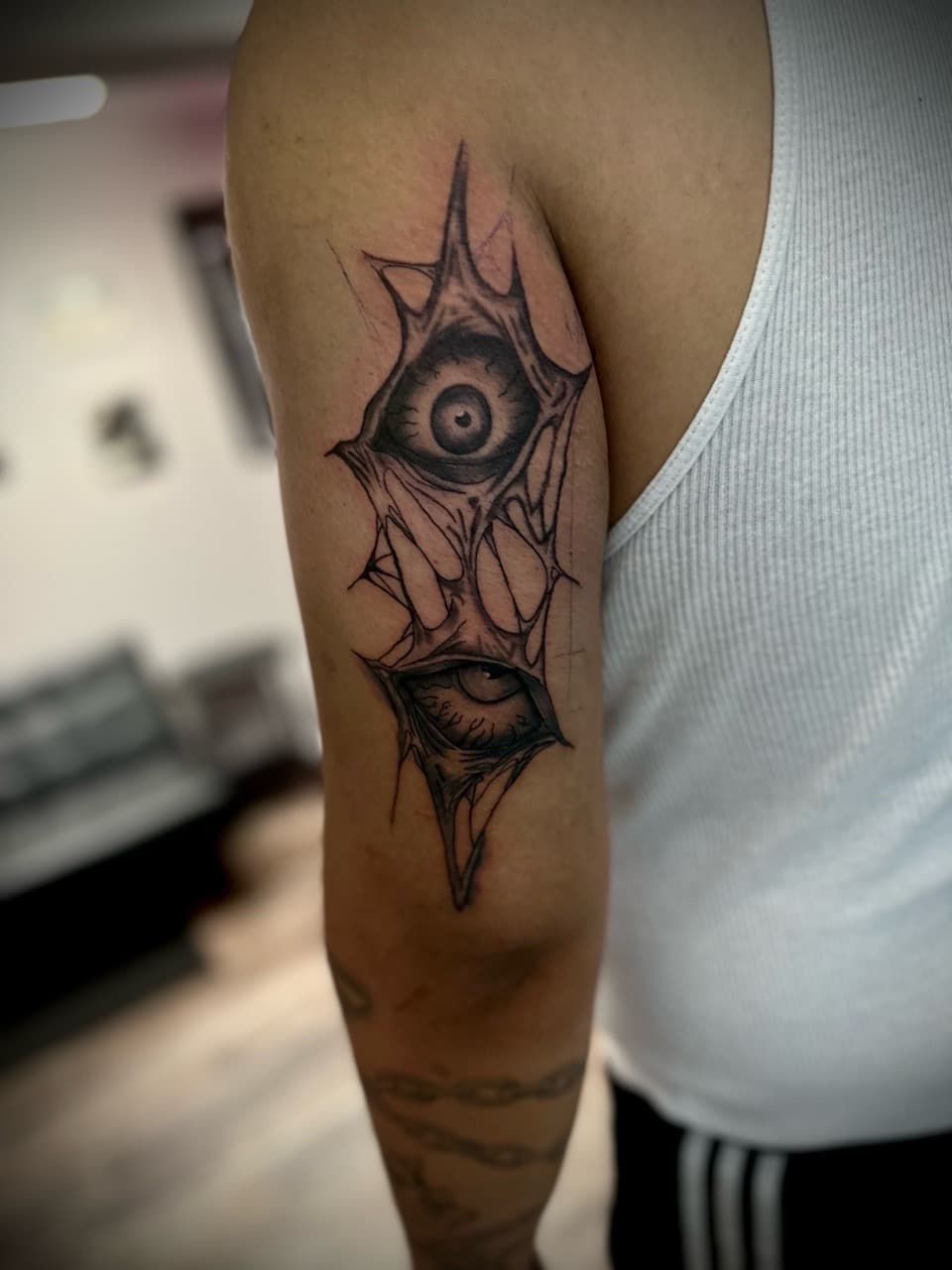 Black & Grey + Surrealism eyes tattoo on Upper Arm by Jr on TattMe