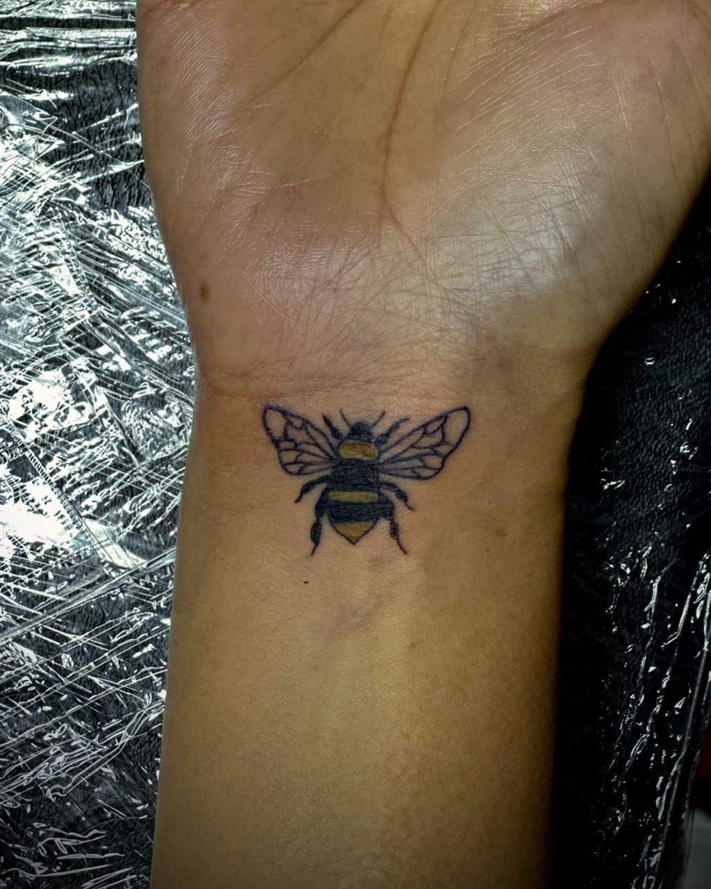 Color + Minimalist bee tattoo on Wrist by Jr on TattMe
