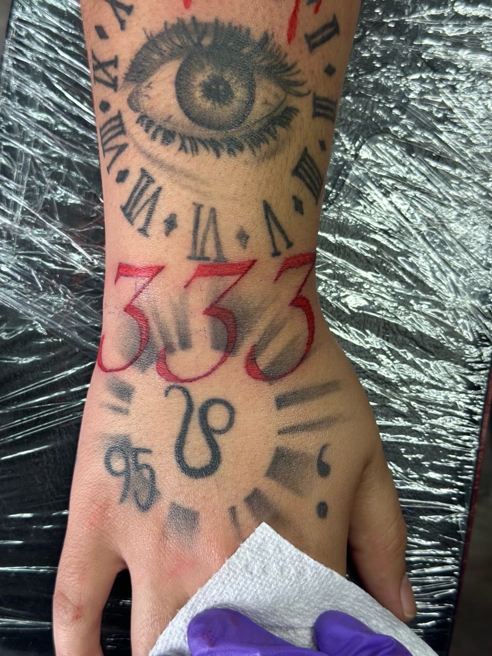 Black & Grey + Lettering eye tattoo on Wrist by Jr on TattMe