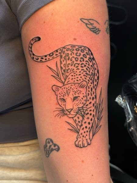 Fine Line + Black-work leopard tattoo on Upper Arm by Jr on TattMe