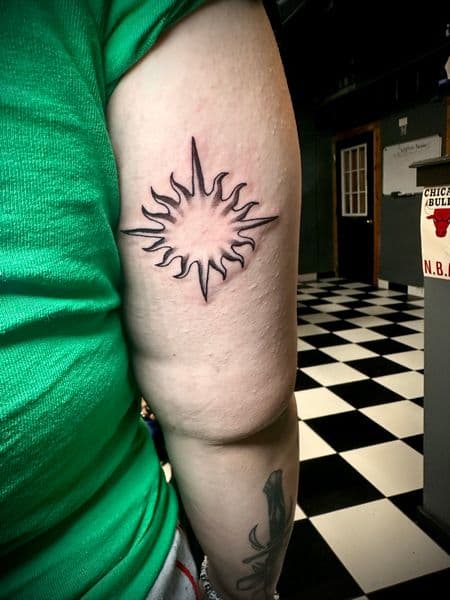 Black-work + Line-work sun tattoo on Upper Arm by Jr on TattMe