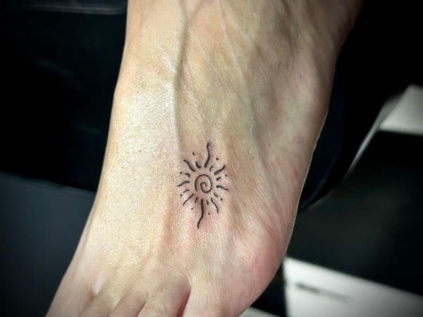 Fine Line + Black-work sun tattoo on Foot by Jr on TattMe