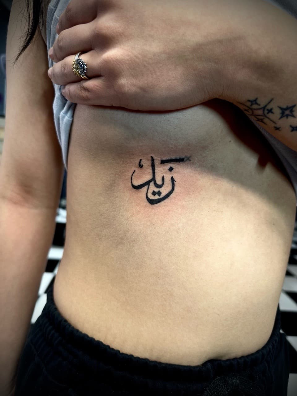 Lettering + Script arabic tattoo on Ribs by Jr on TattMe