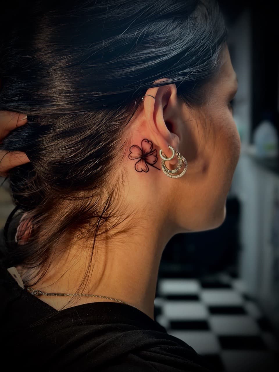Fine Line + Black-work four-leaf clover tattoo on Behind Ear by Jr on TattMe