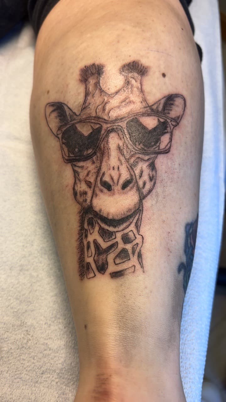 Black & Grey + Illustrative giraffe tattoo on Forearm by Second_Chance_Tattoo_Studio on TattMe