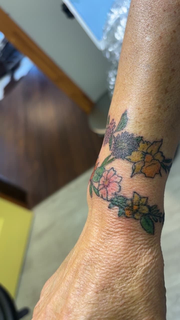 Floral + Color flowers tattoo on Wrist by Second_Chance_Tattoo_Studio on TattMe