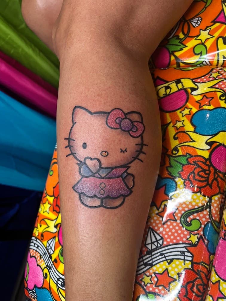 Pop Culture + Cartoon hello kitty tattoo on Calf by MillzyInk on TattMe