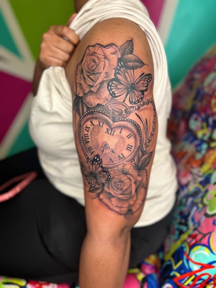 Black & Grey + Illustrative roses tattoo on Upper Arm by MillzyInk on TattMe