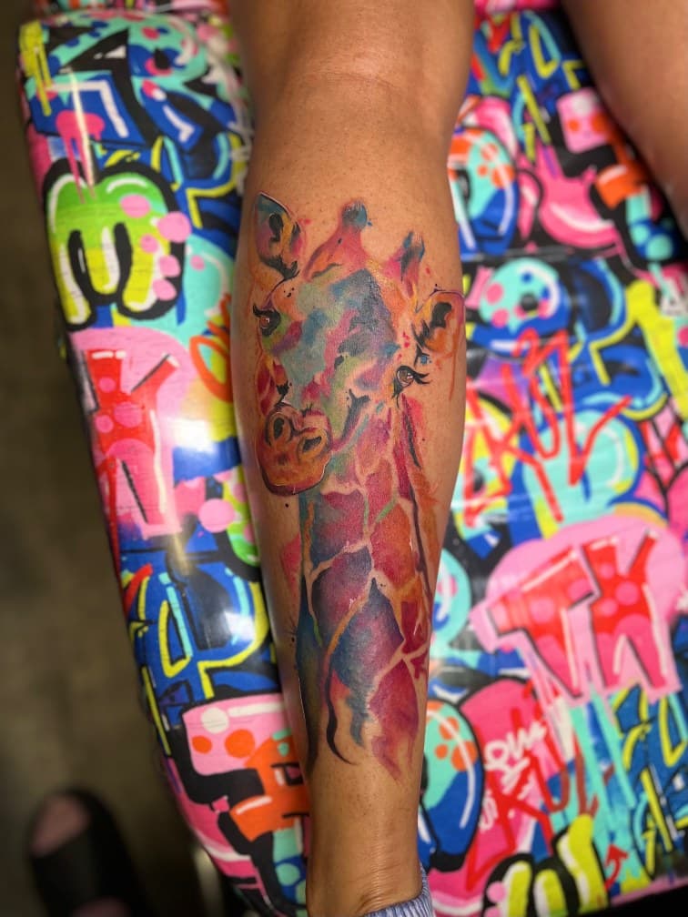 Watercolor + Animals giraffe tattoo on Calf by MillzyInk on TattMe