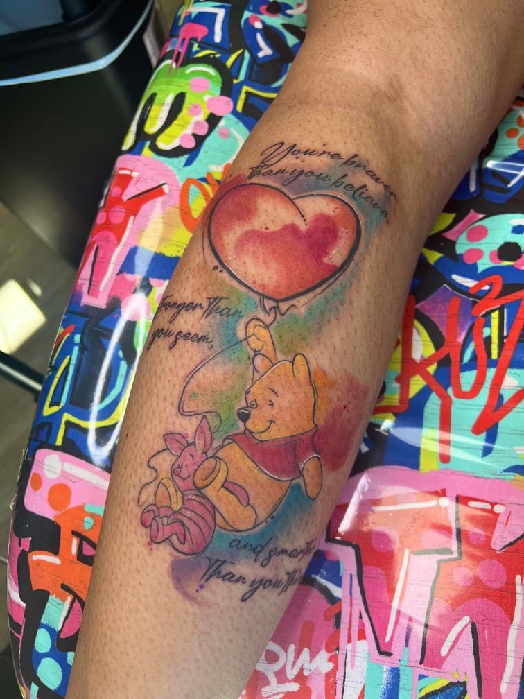 Watercolor + Cartoon winnie the pooh tattoo on Calf by MillzyInk on TattMe