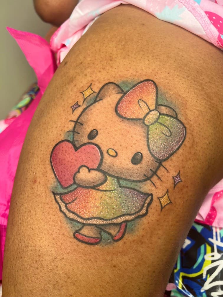 Color + Cartoon hello kitty tattoo on Thigh by MillzyInk on TattMe