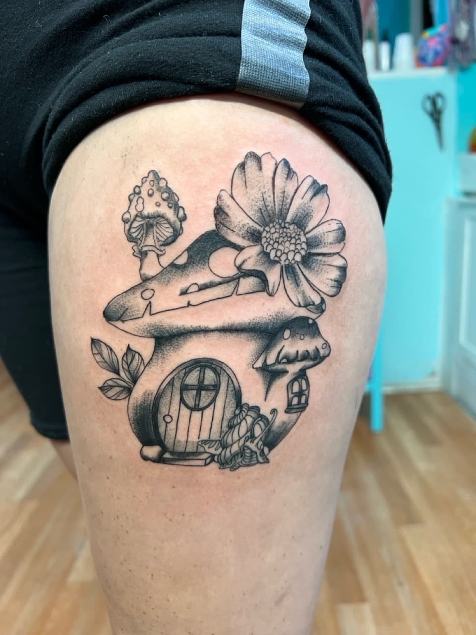 Black & Grey + Illustrative mushroom house tattoo on Thigh by Matt_Mason_Tattoos on TattMe