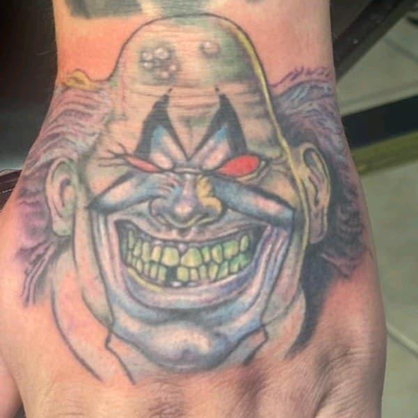 Color + New School clown tattoo on Hand by affiliatedtattoofamily on TattMe