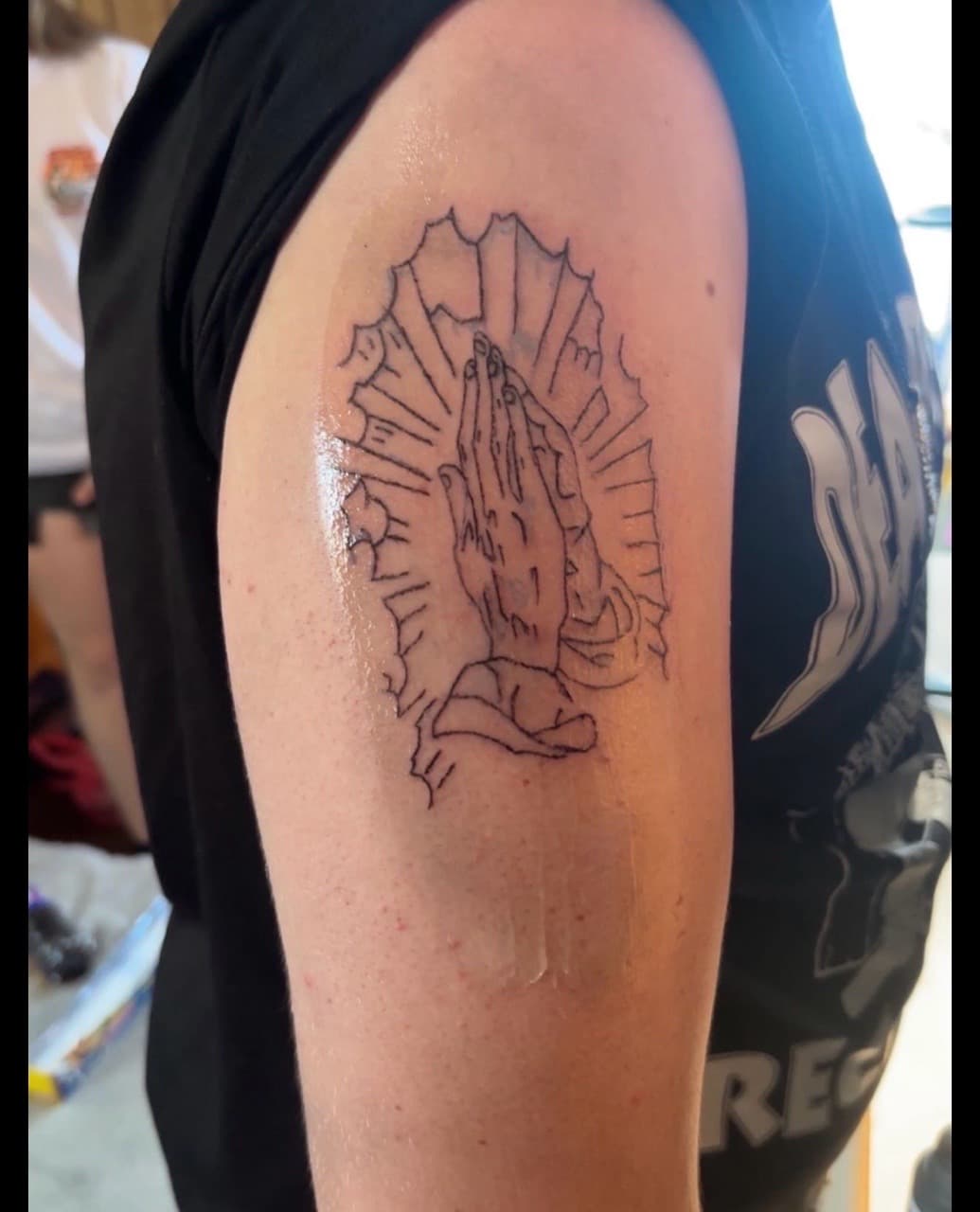 Fine Line + Black-work praying hands tattoo on Upper Arm by gages_works on TattMe