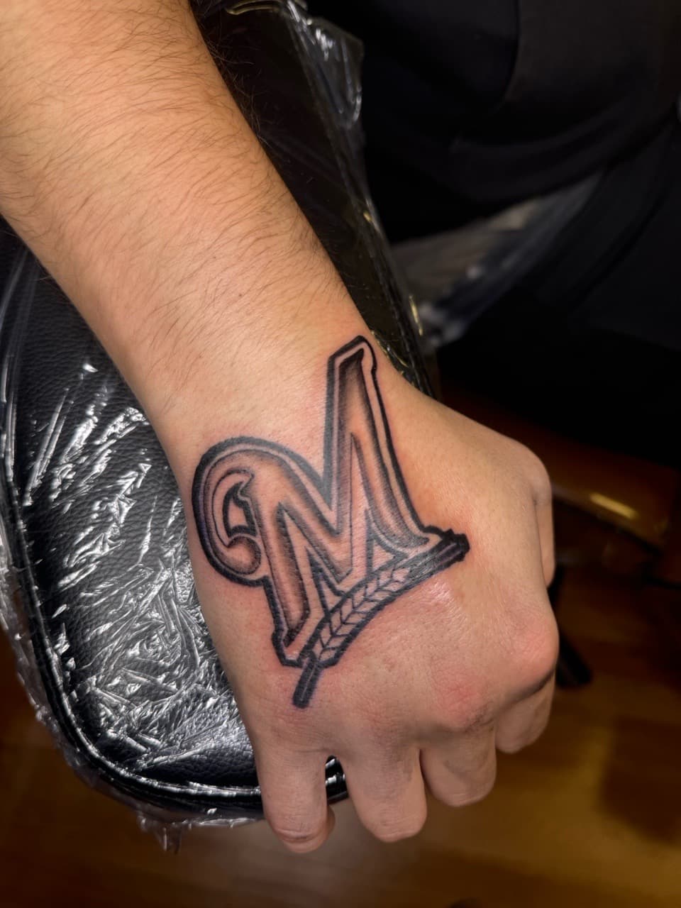 Lettering + Black & Grey letter m tattoo on Hand by KRUZ_TATTOOS on TattMe