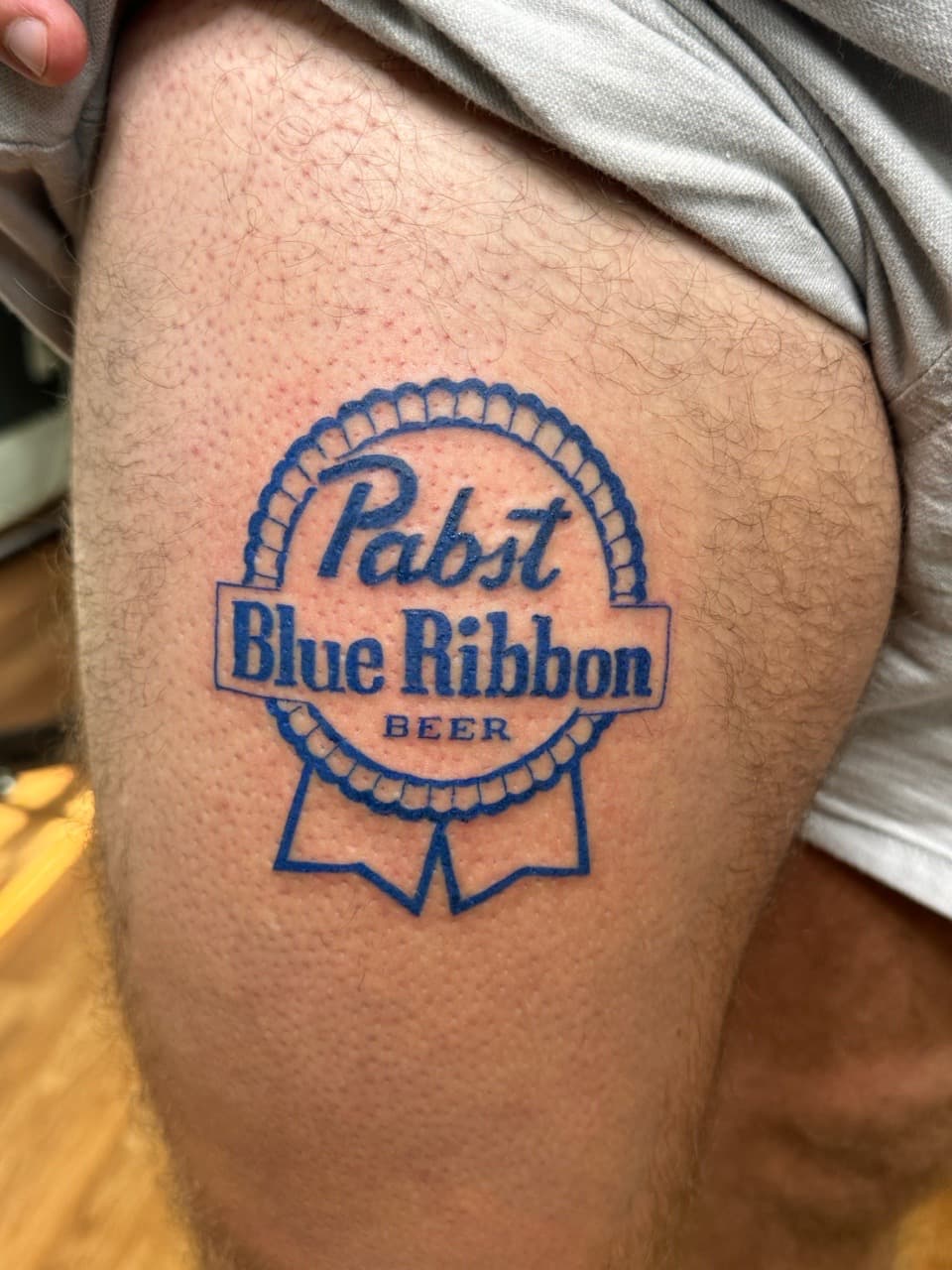 Pop Culture + Lettering logo tattoo on Thigh by KRUZ_TATTOOS on TattMe