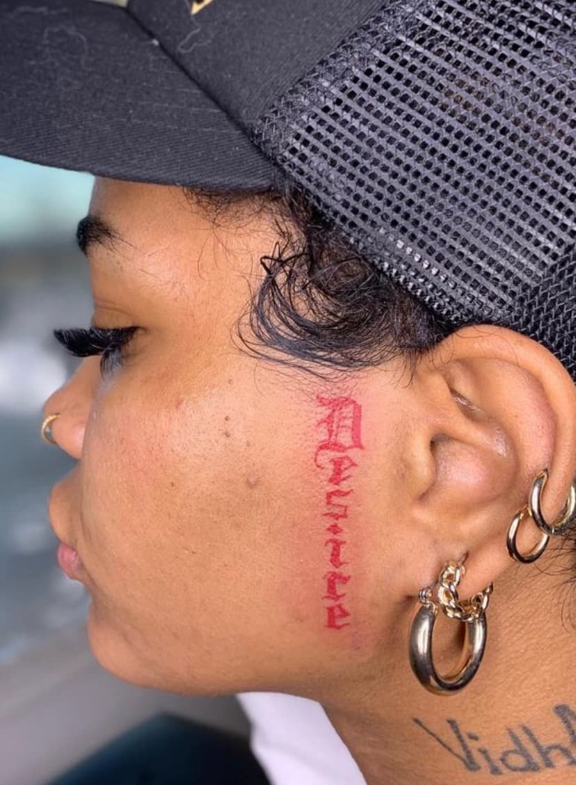 Lettering + Script desire tattoo on Face by KRUZ_TATTOOS on TattMe