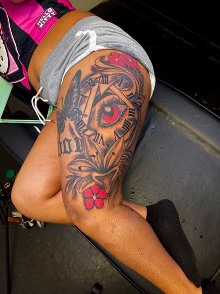 Black & Grey + Color eye tattoo on Thigh by JST on TattMe