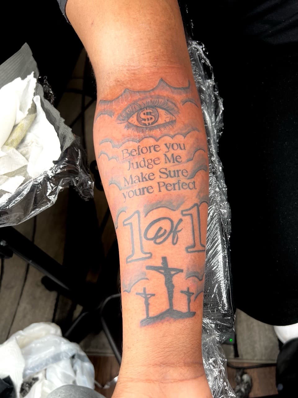 Lettering + Black & Grey eye tattoo on Forearm by JST on TattMe