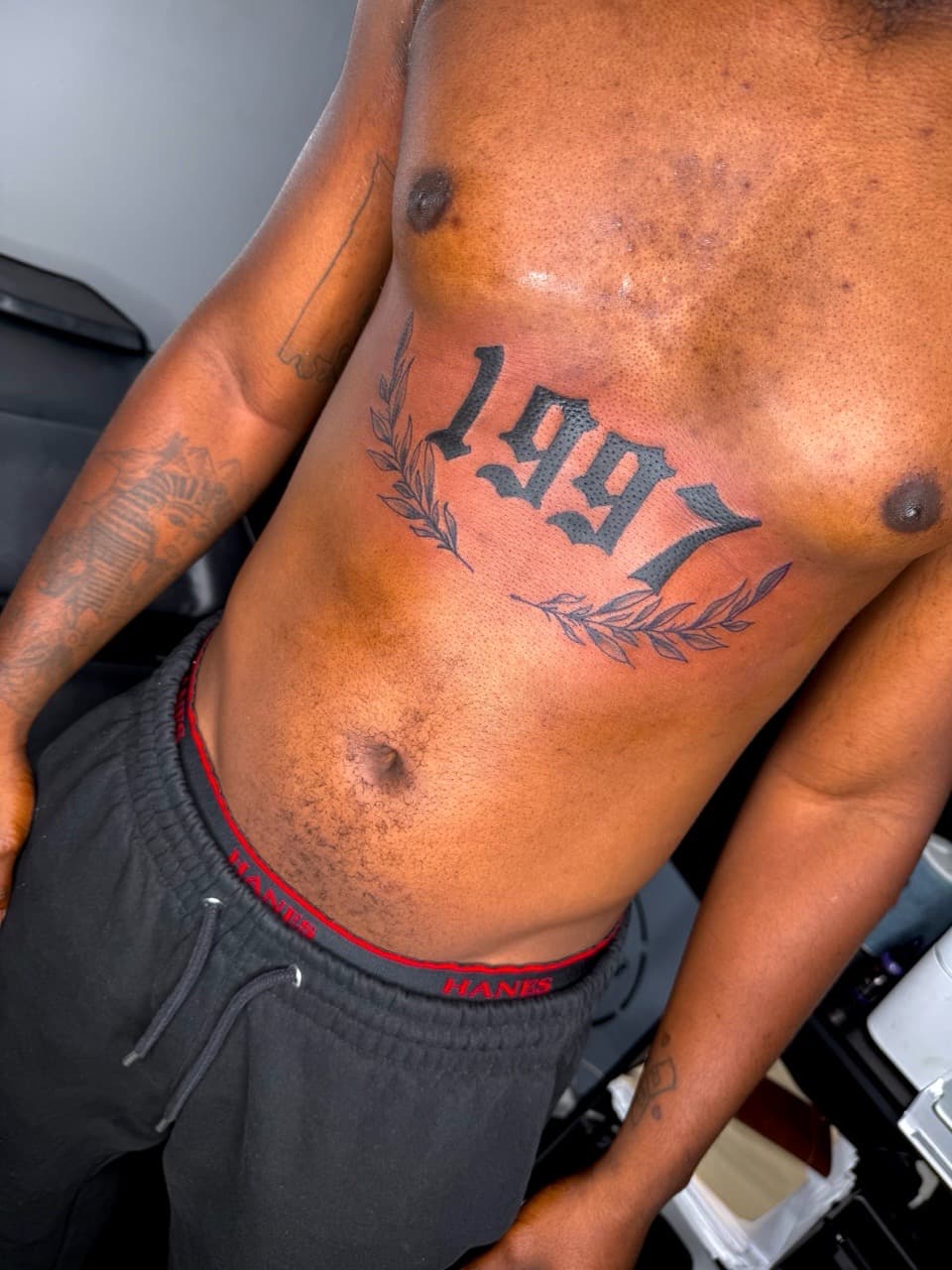 Lettering + Black-work numbers tattoo on Chest by JST on TattMe