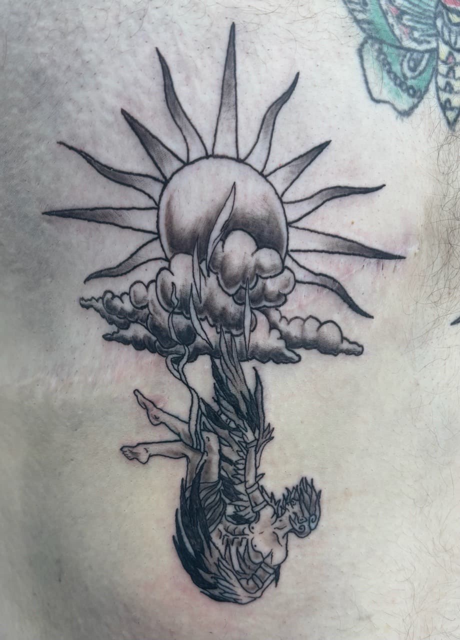 Black & Grey + Illustrative sun tattoo on Chest by AdrianWareTattoos on TattMe