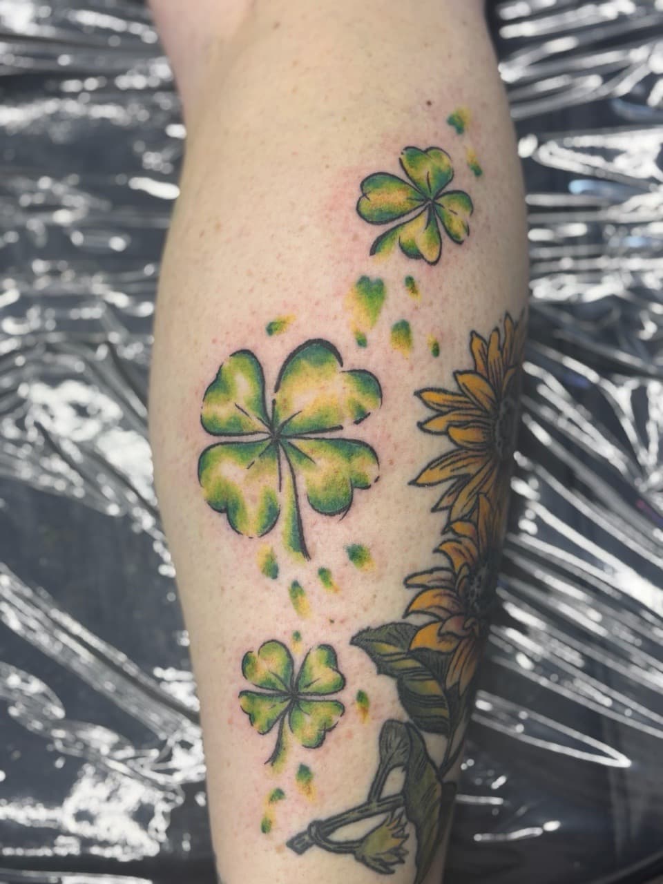 Color + Floral clovers tattoo on Calf by AdrianWareTattoos on TattMe