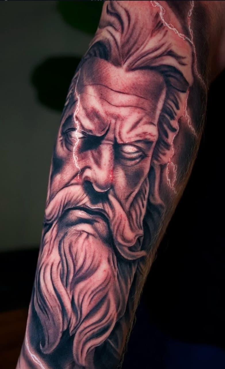 Realism + Black & Grey zeus tattoo on Forearm by Tattoosbyjm on TattMe