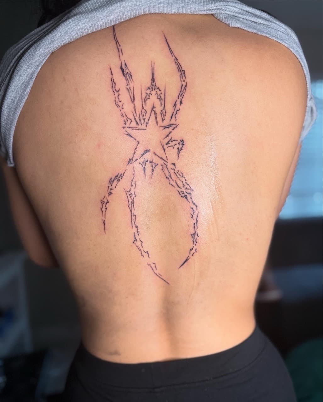 Line-work + Fine Line spider tattoo on Upper Back by Jarieliz_Stick_and_Ink on TattMe