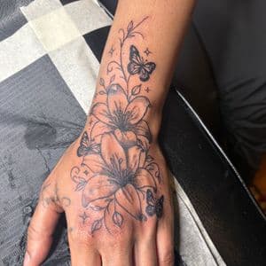 Fine Line + Black & Grey flowers tattoo on Hand by hippie.Inkster on TattMe