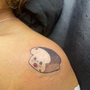 Cartoon + Color bread tattoo on Shoulder by hippie.Inkster on TattMe