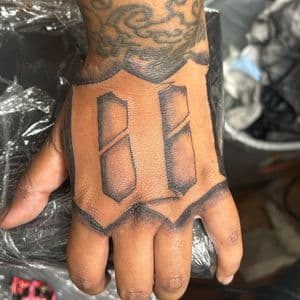 Chicano + Lettering letter tattoo on Hand by hippie.Inkster on TattMe