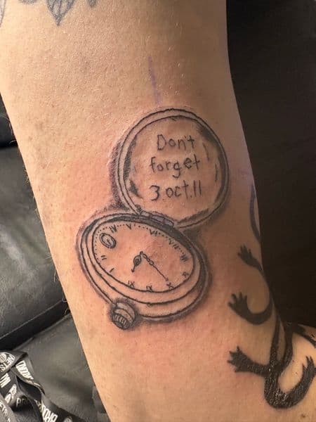 Black & Grey + Line-work pocket watch tattoo on Upper Arm by hippie.Inkster on TattMe