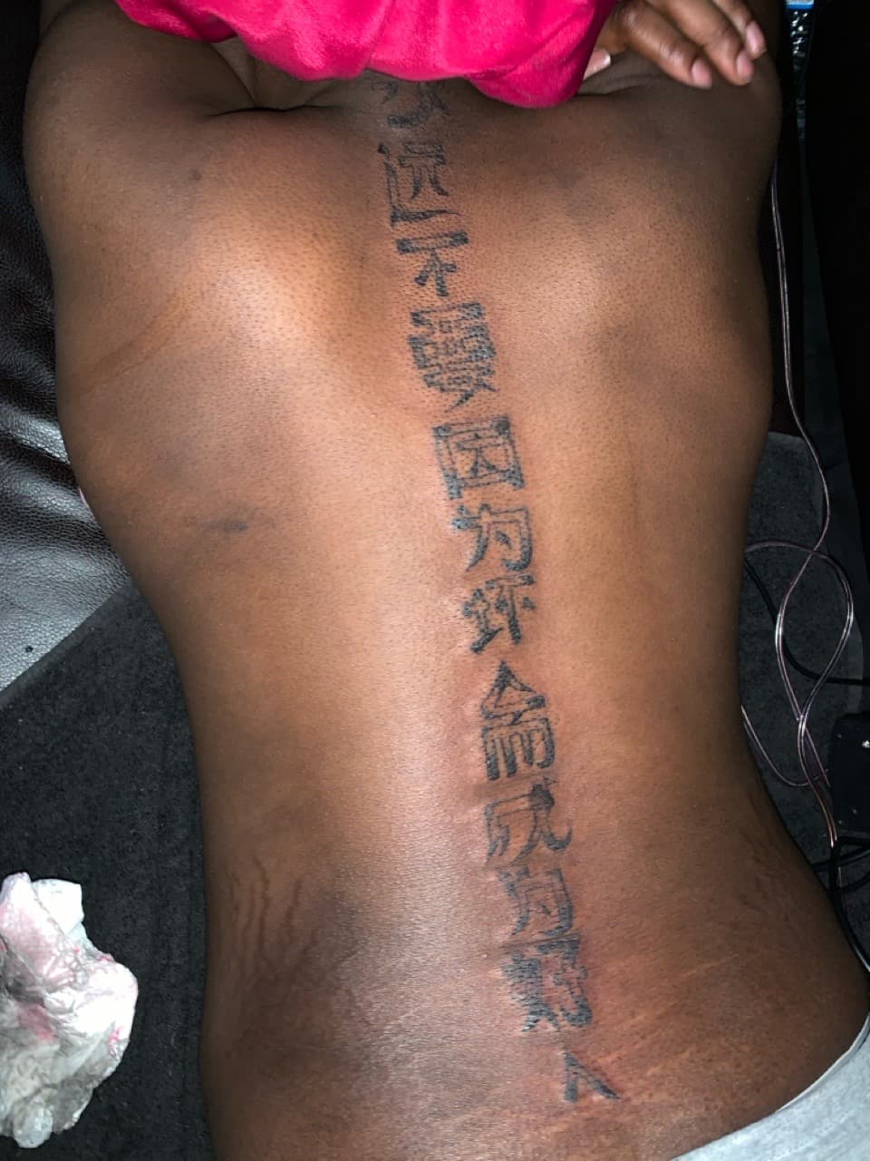 Lettering + Script characters tattoo on Spine by hippie.Inkster on TattMe