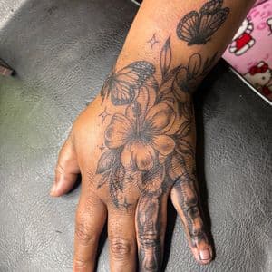 Black-work + Floral butterfly tattoo on Hand by hippie.Inkster on TattMe