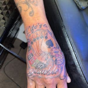 Lettering + Black & Grey gambling tattoo on Hand by hippie.Inkster on TattMe
