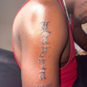 Lettering + Script date tattoo on Upper Arm by hippie.Inkster on TattMe