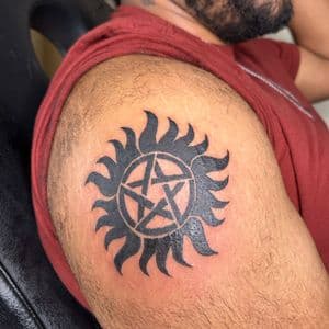Black-work + Symbolic pentagram tattoo on Upper Arm by hippie.Inkster on TattMe