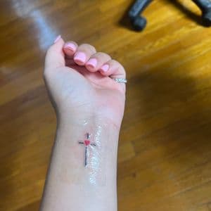 Fine Line + Minimalist cross tattoo on Wrist by hippie.Inkster on TattMe
