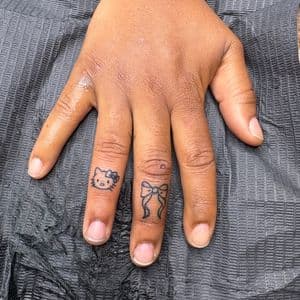 Fine Line + Minimalist hello kitty tattoo on Fingers by hippie.Inkster on TattMe