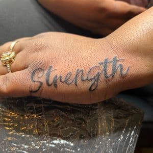 Lettering + Script strength tattoo on Hand by hippie.Inkster on TattMe