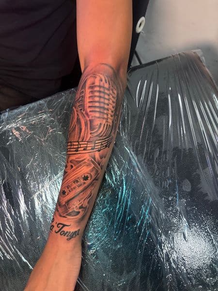 Black & Grey + Illustrative microphone tattoo on Forearm by Tattoos_by_Dalton on TattMe