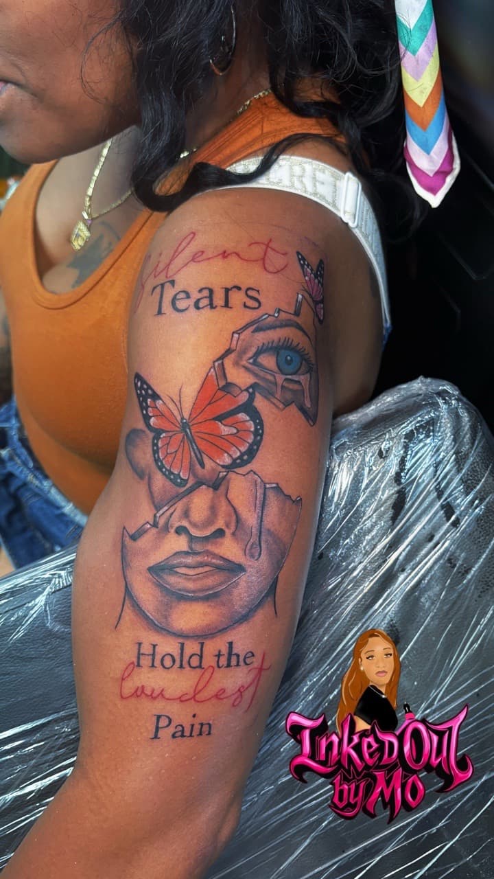Illustrative + Black & Grey face tattoo on Upper Arm by Inked_Out_by_Mo on TattMe