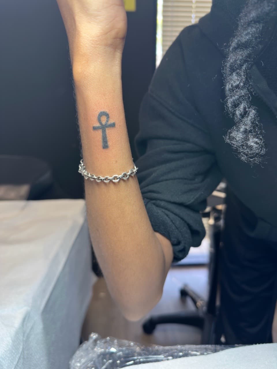Minimalist + Black-work ankh tattoo on Wrist by Inkbyj on TattMe