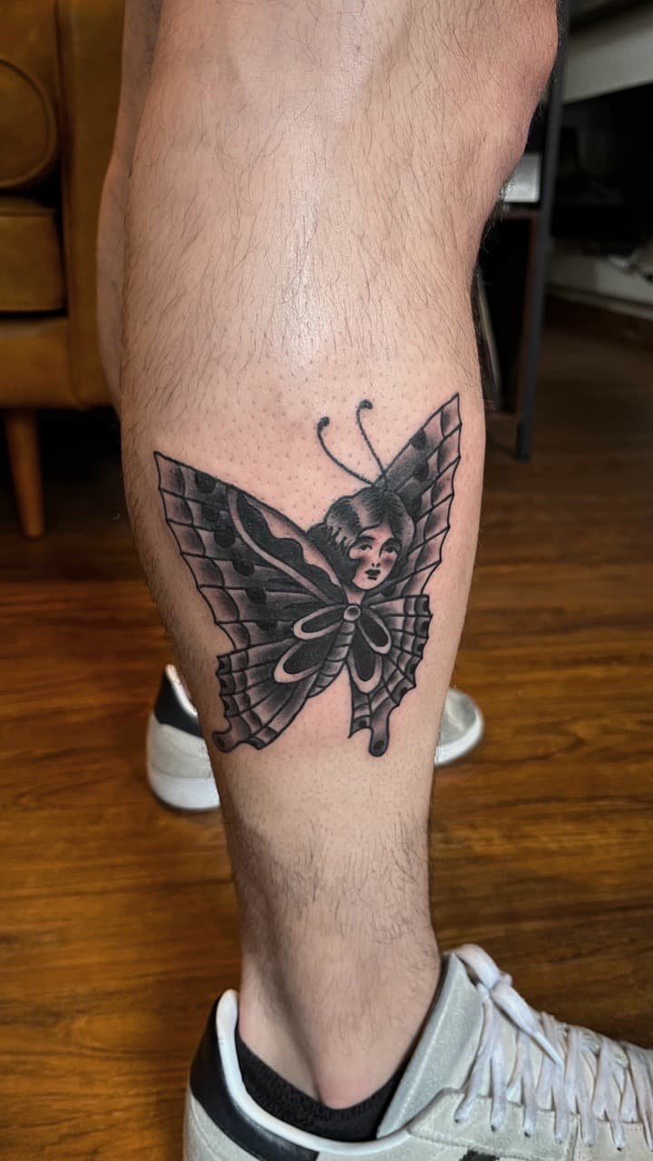 Traditional + Black & Grey butterfly tattoo on Calf by high_hurdle_tattoo on TattMe