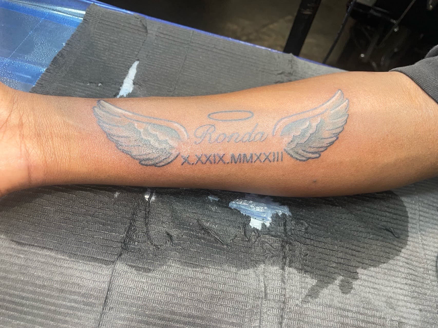 Black & Grey + Lettering wings tattoo on Forearm by InkedByKellz on TattMe