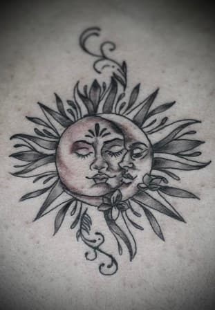 Black & Grey + Illustrative sun tattoo on Upper Back by Arttrigga on TattMe